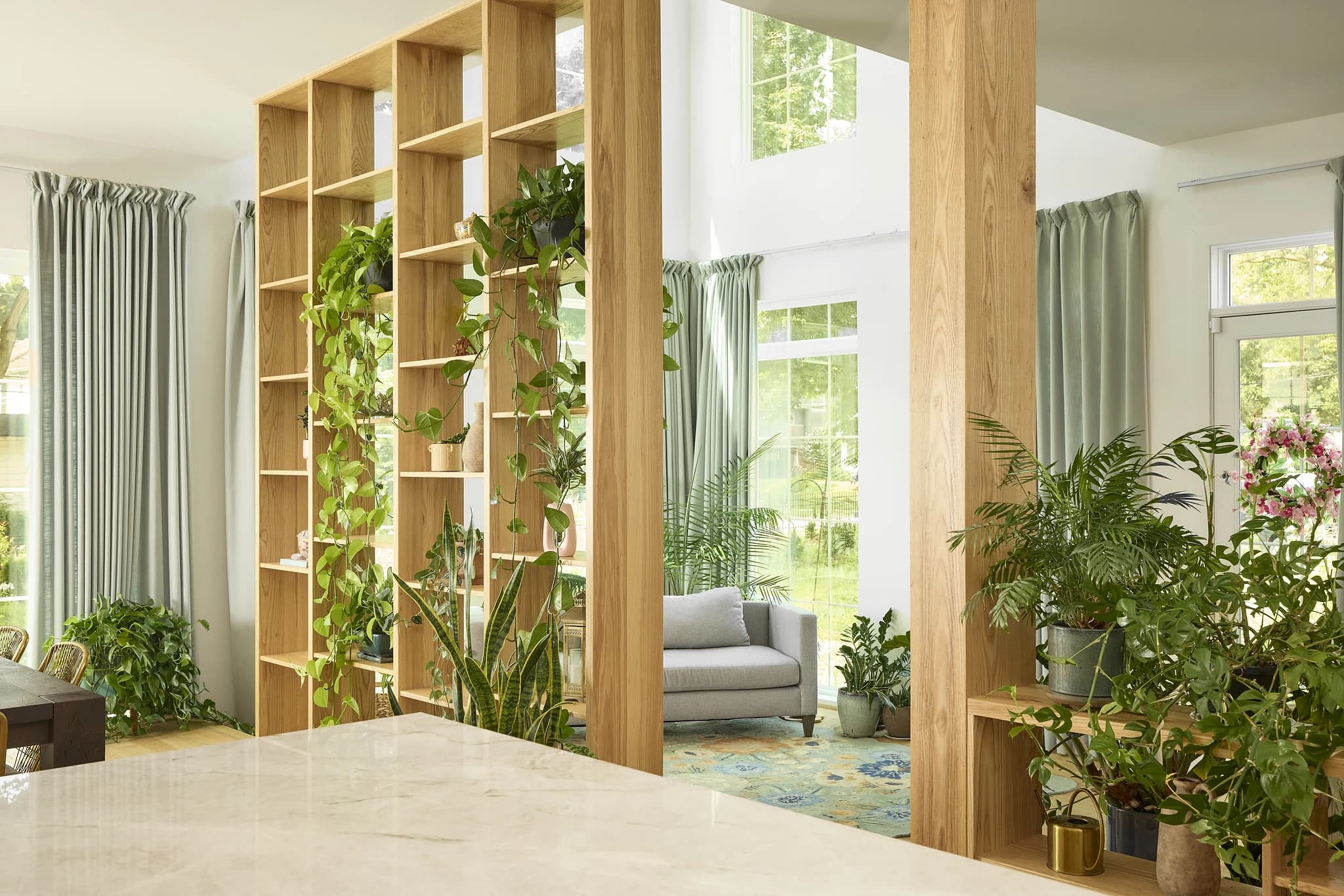 Blue custom pantry with built-in storage, cabinetry, and brass hardware in Meridian-Kessler.